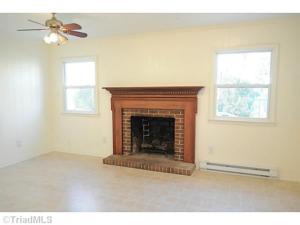 The first part of the kitchen with the fireplace.